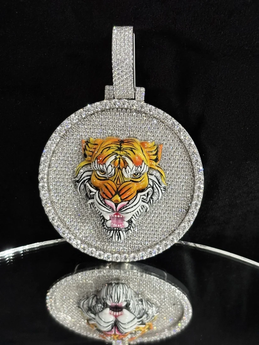 Diamond iced out round pendant necklace featuring a detailed orange and yellow enamel tiger head