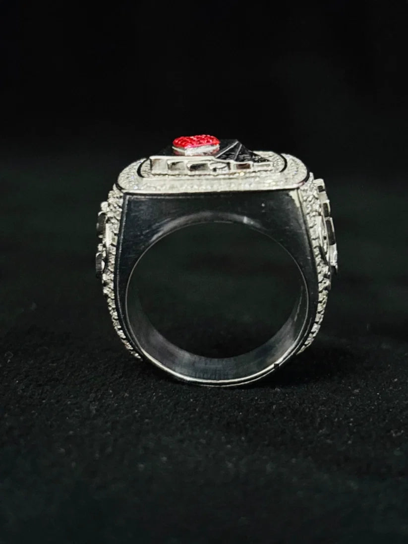Chunky silver sports championship ring with pavé setting viewed from the side band