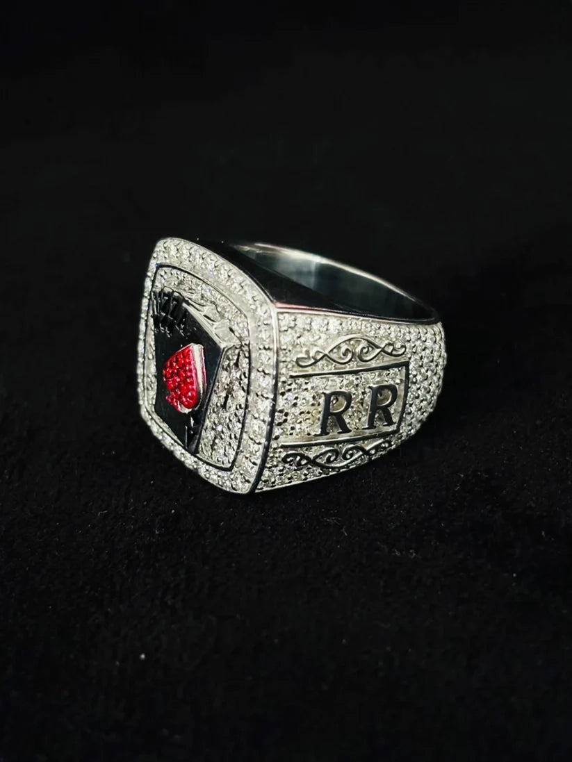 Iced out silver playing card championship style ring with red and white pave stones and engraved side details