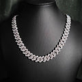 Silver iced out prong-set Cuban link chain necklace displayed on a black mannequin bust