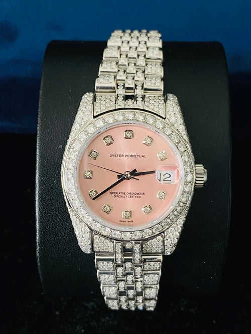 front view Luxury diamond-encrusted Rolex Oyster Perpetual Datejust watch with a pink dial and Jubilee watch band
