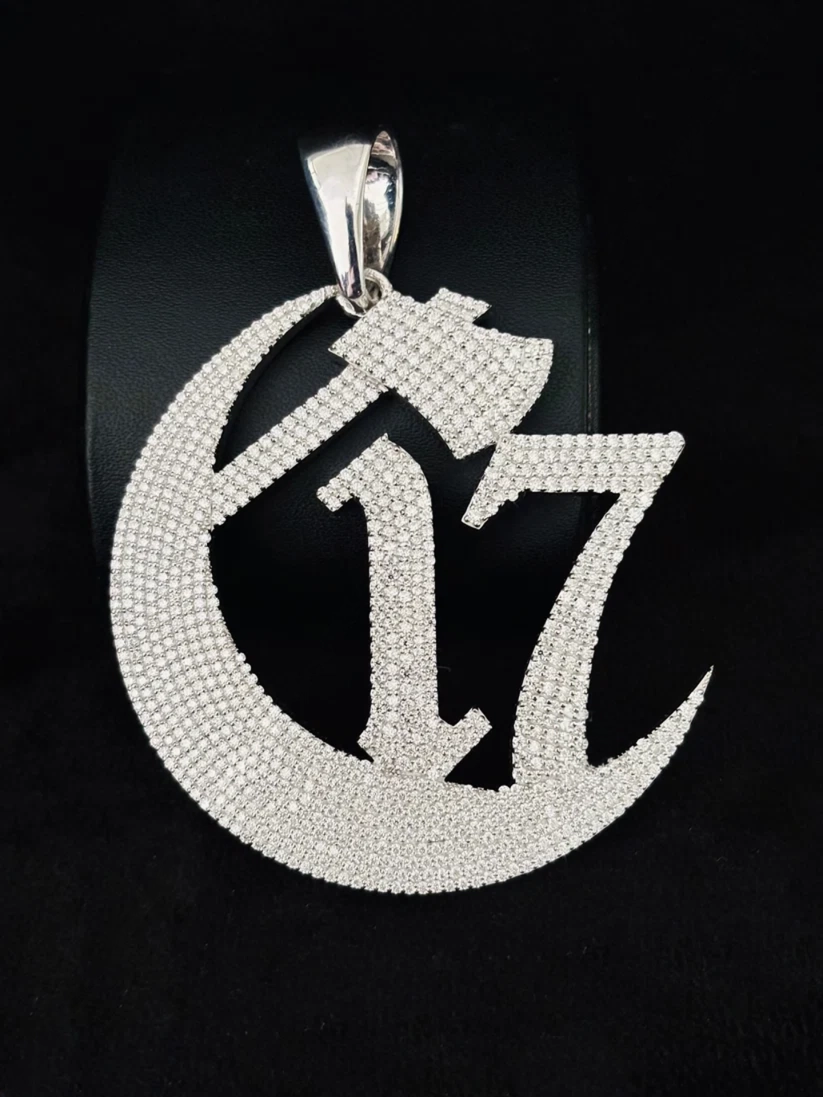front view 925 sterling silver iced out Chapter 17 crescent moon and hatchet pendant charm