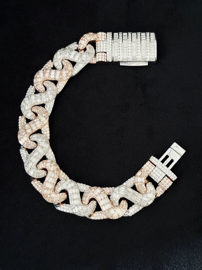 Close-up of a heavy two-tone diamond Cuban link bracelet