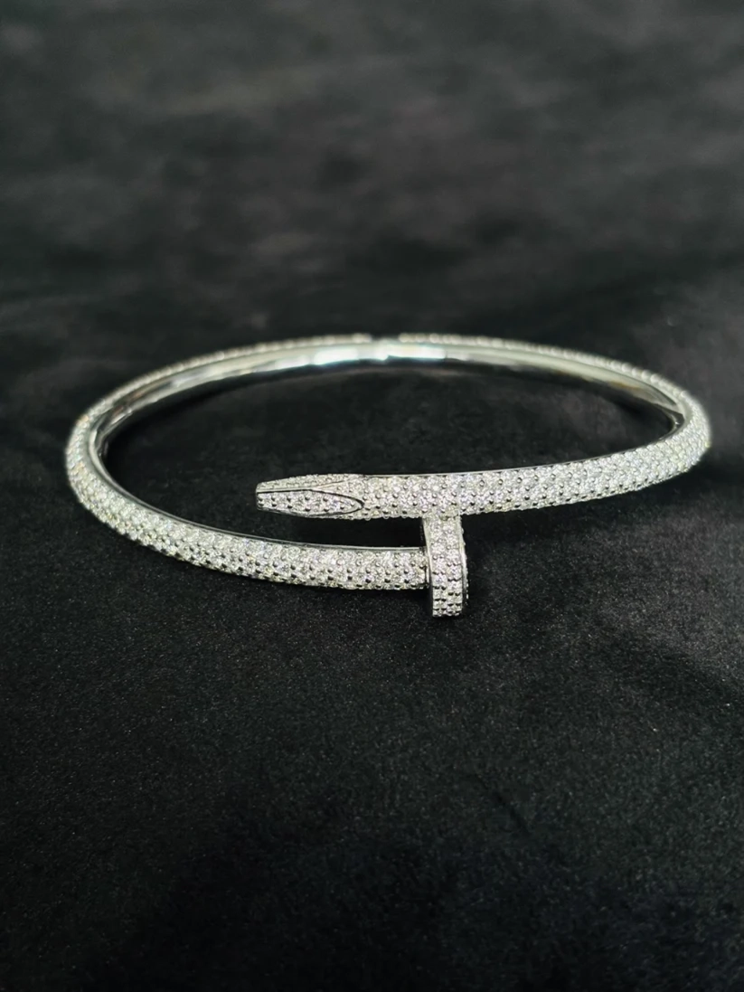 A front view silver open cuff bracelet paved with small Moissanite diamond
