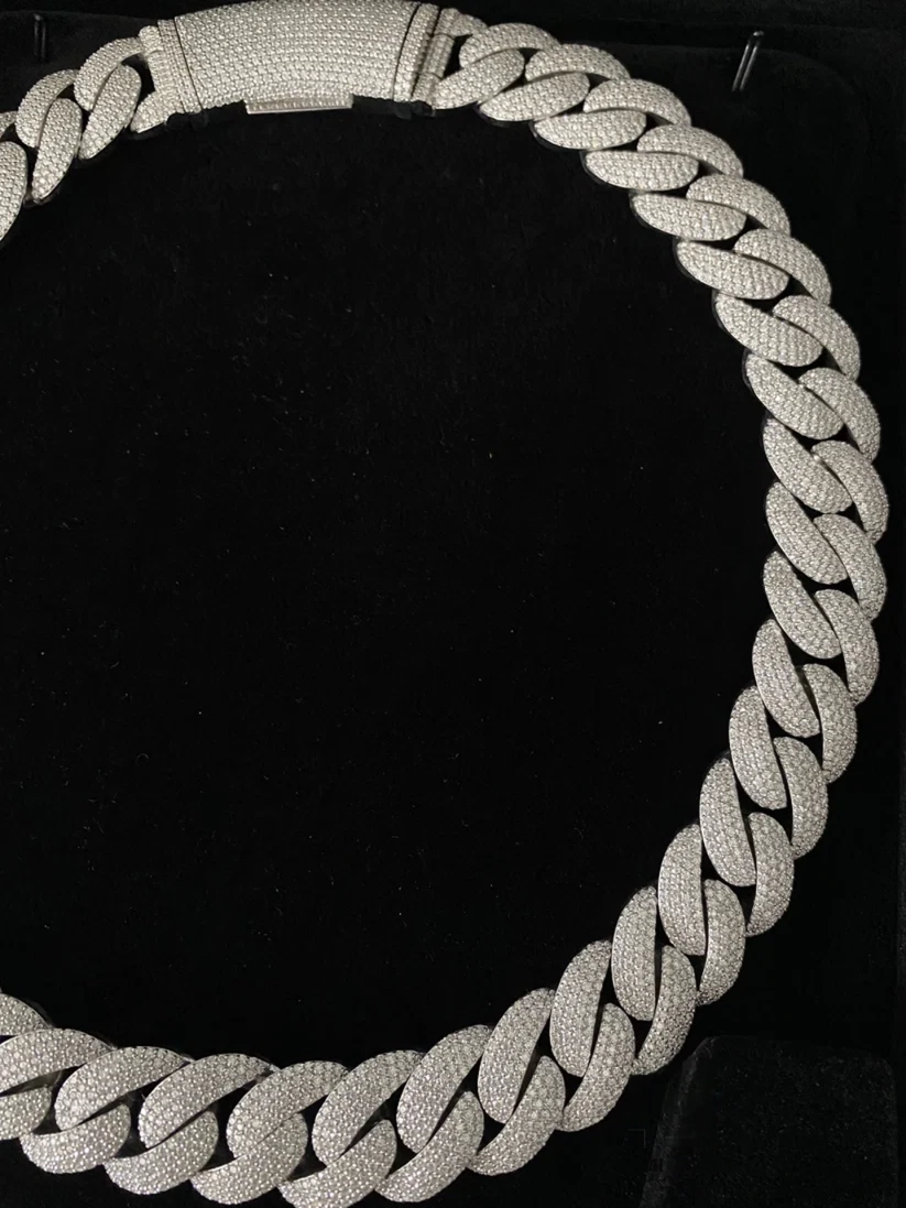 Iced out silver Miami Cuban link chain necklace with pave diamond accents and iced lock clasp
