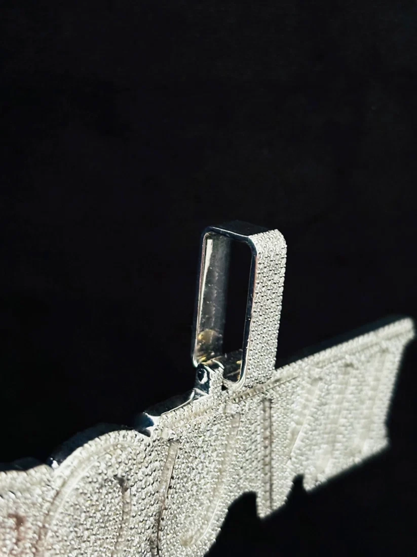 Iced out custom name pendant with micro pave diamond setting side view