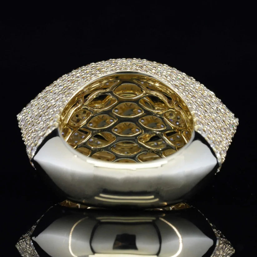 Underside of a wide gold diamond ring showing the intricate lattice design gallery