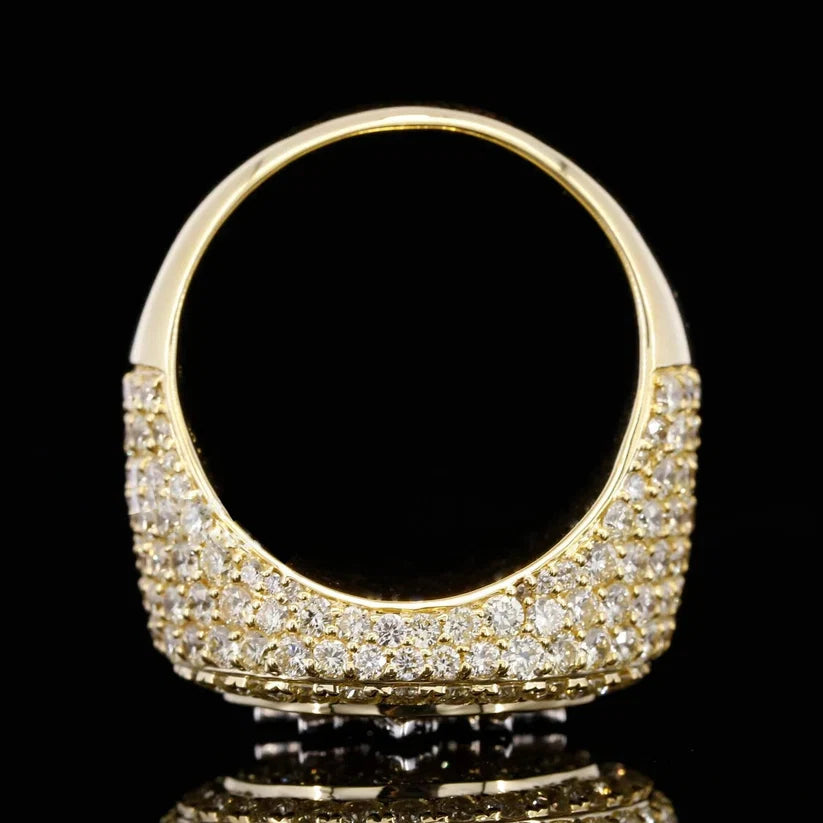 Close-up profile of a thick yellow gold plated band embellished with a dense pave diamond setting