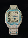 front view of the Fully iced-out diamond watch with turquoise bezel and skeleton dial