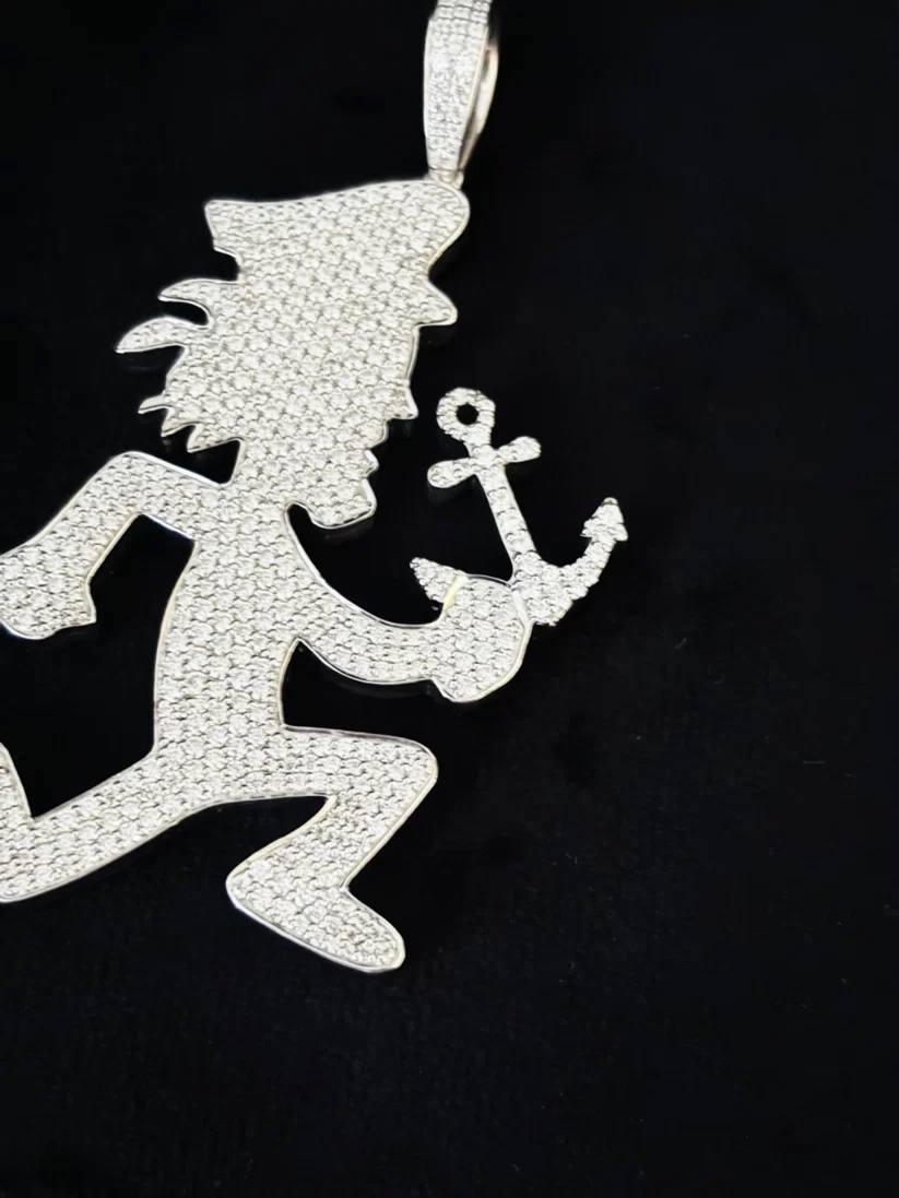 polished silver Hatchetman pendant, the iconic symbol associated with the music group Insane Clown 