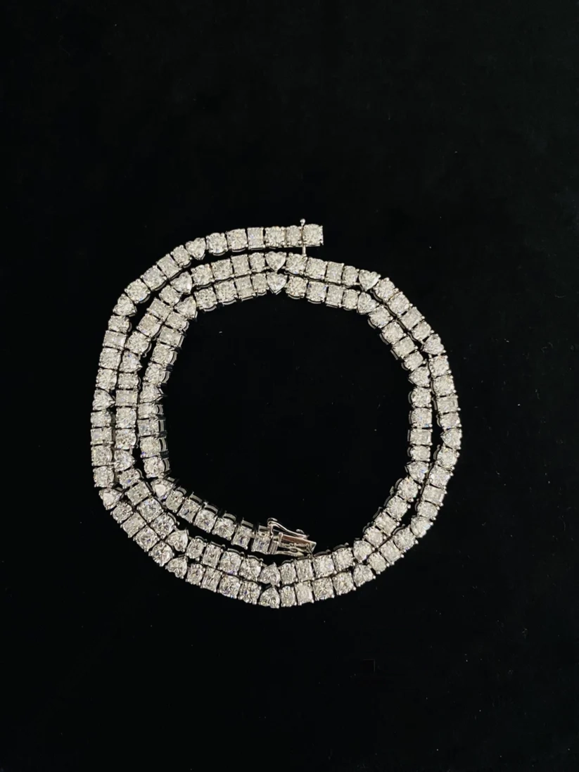 Classic diamond tennis necklace styled in a spiral layout
