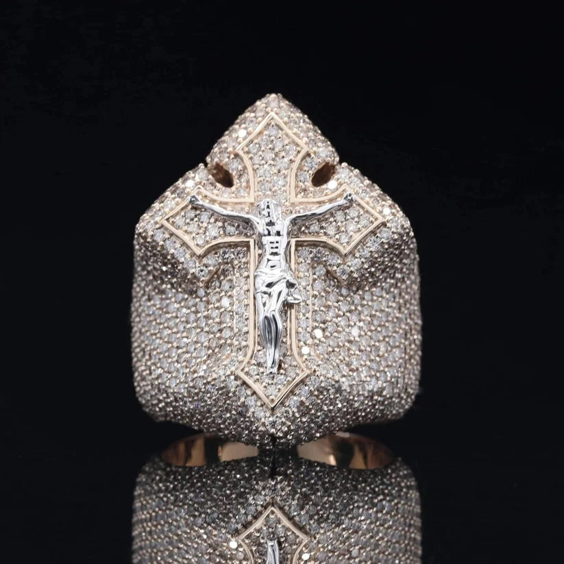 Large white gold signet ring featuring a detailed crucifix cross encrusted with small pave diamonds