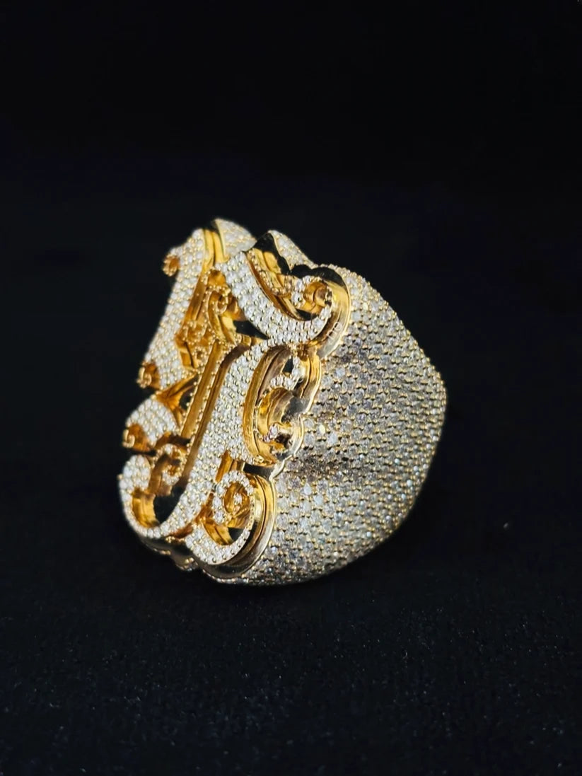 Large custom hip-hop monogram pinky ring in featuring heavy diamond pave setting
