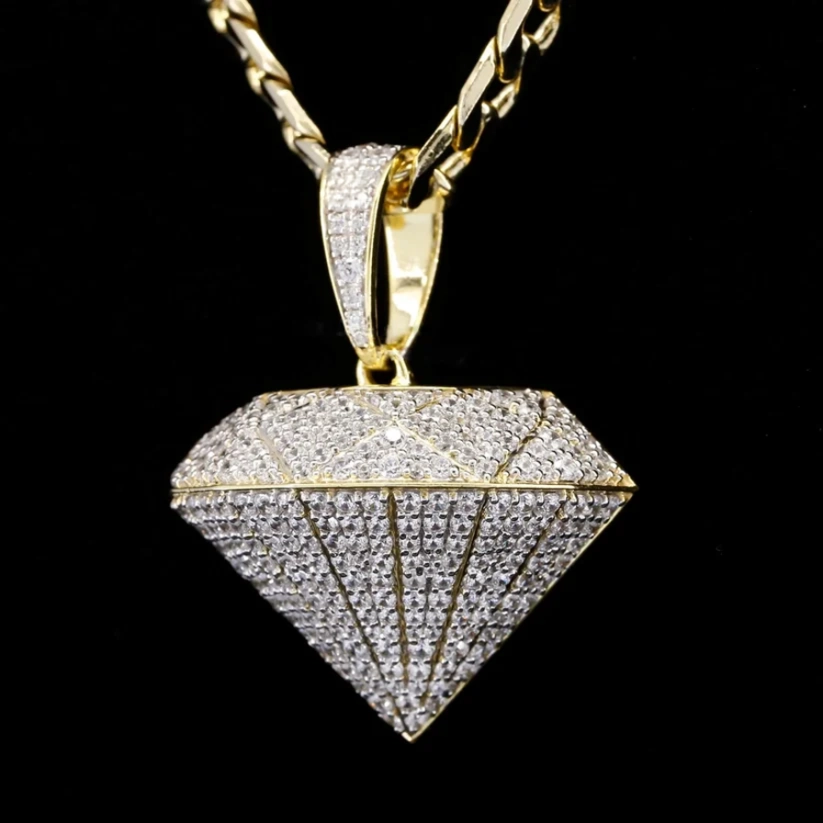 front view Gold diamond shaped pendant necklace encrusted with pave diamonds hanging from a gold chain.