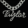 front view Silver chain necklace with 'Taylor' pendant on a black background