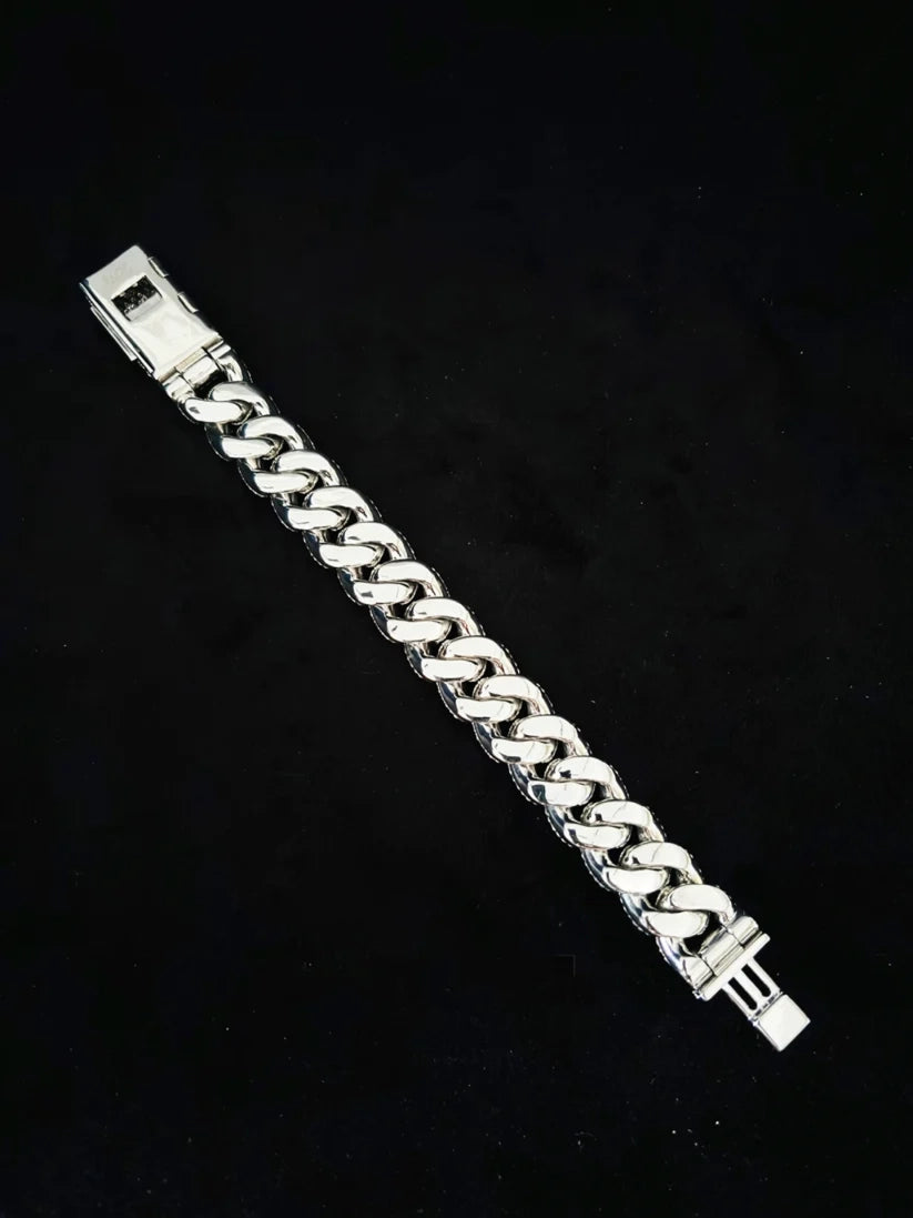 Men's heavy sterling silver curb chain bracelet on a black background