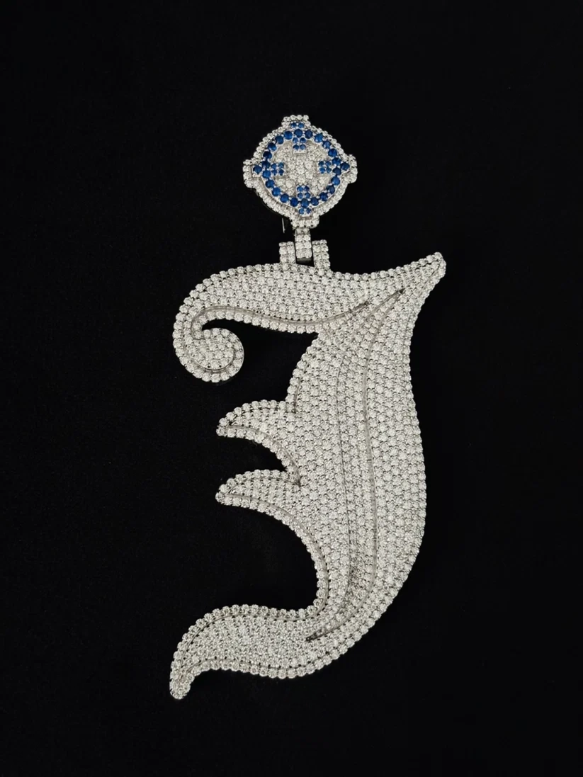 front view Iced out old English letter J diamond pendant with blue stone bail