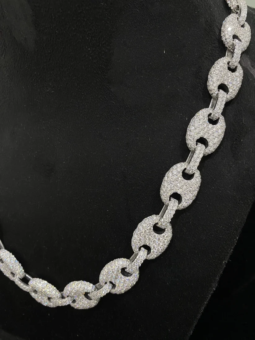 side view of the Silver iced out puff mariner link chain necklace covered in pave diamonds