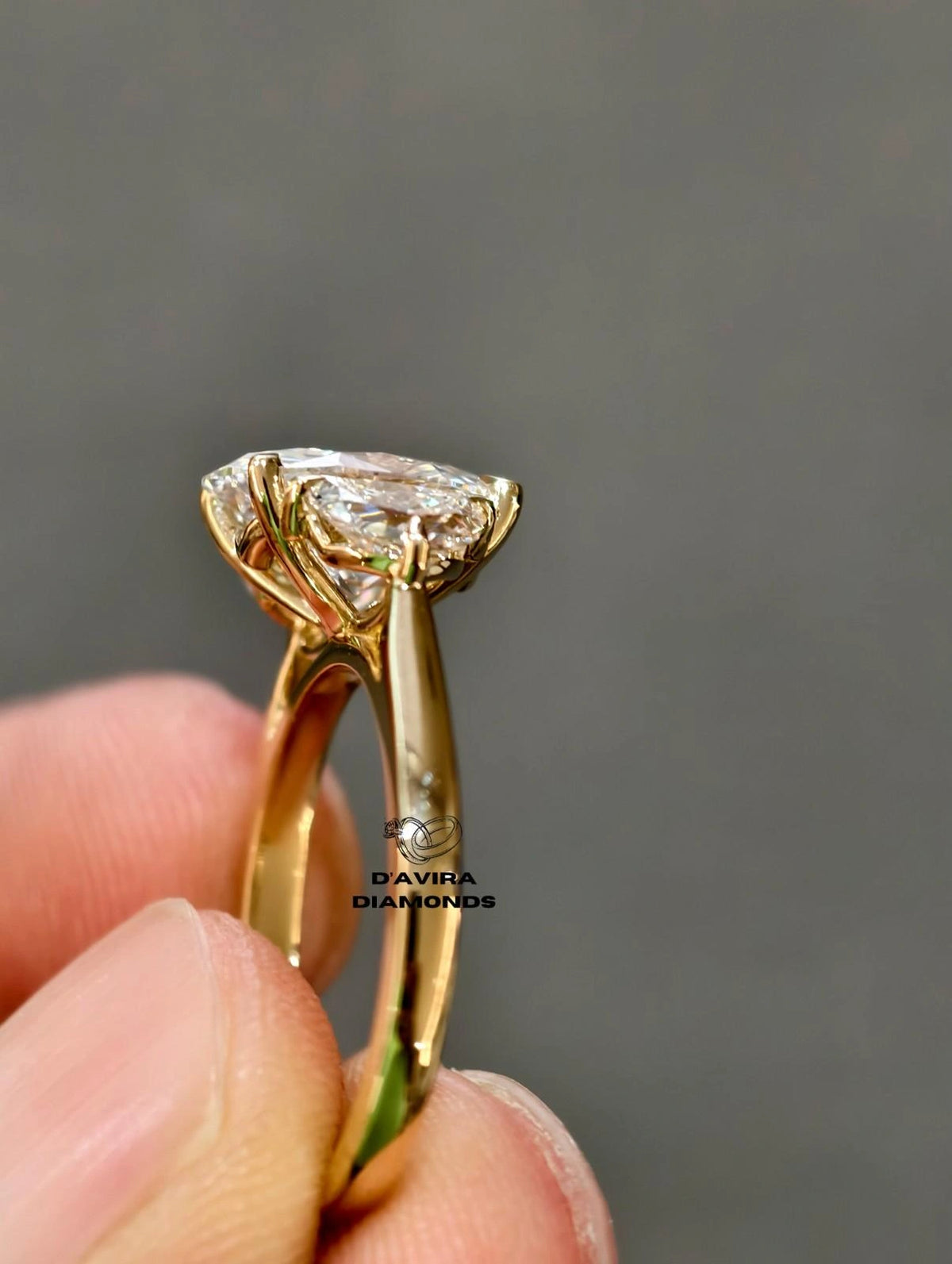 Side View gold ring with a heart shaped diamond cluster setting