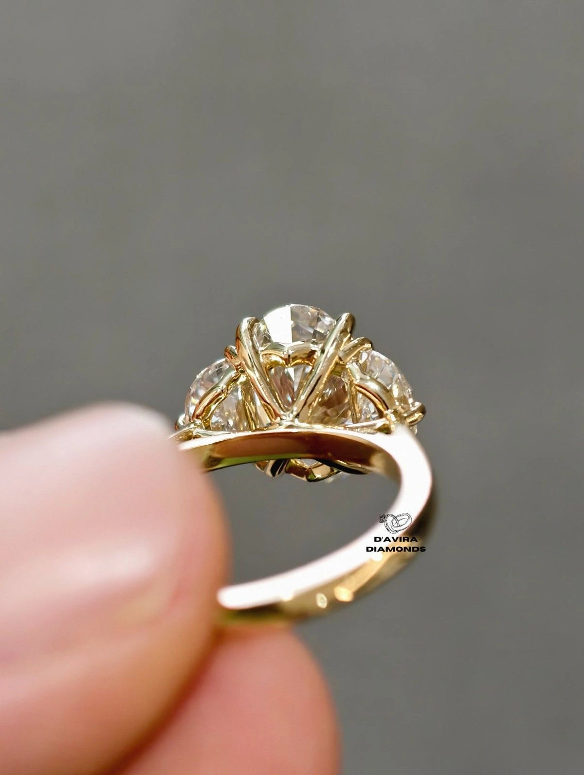 Side profile view of a three stone oval lab diamond Wedding ring 
