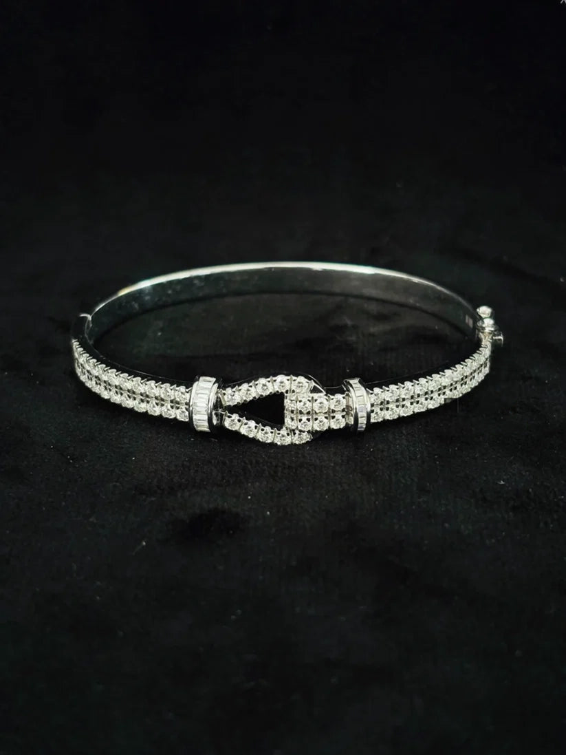 Elegant silver diamond-encrusted bangle showcasing a modern buckle design