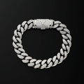 A silver Cuban link chain bracelet paved, featuring a central clasp engraved with the letter 'M'