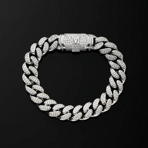 A silver Cuban link chain bracelet paved, featuring a central clasp engraved with the letter 'M'