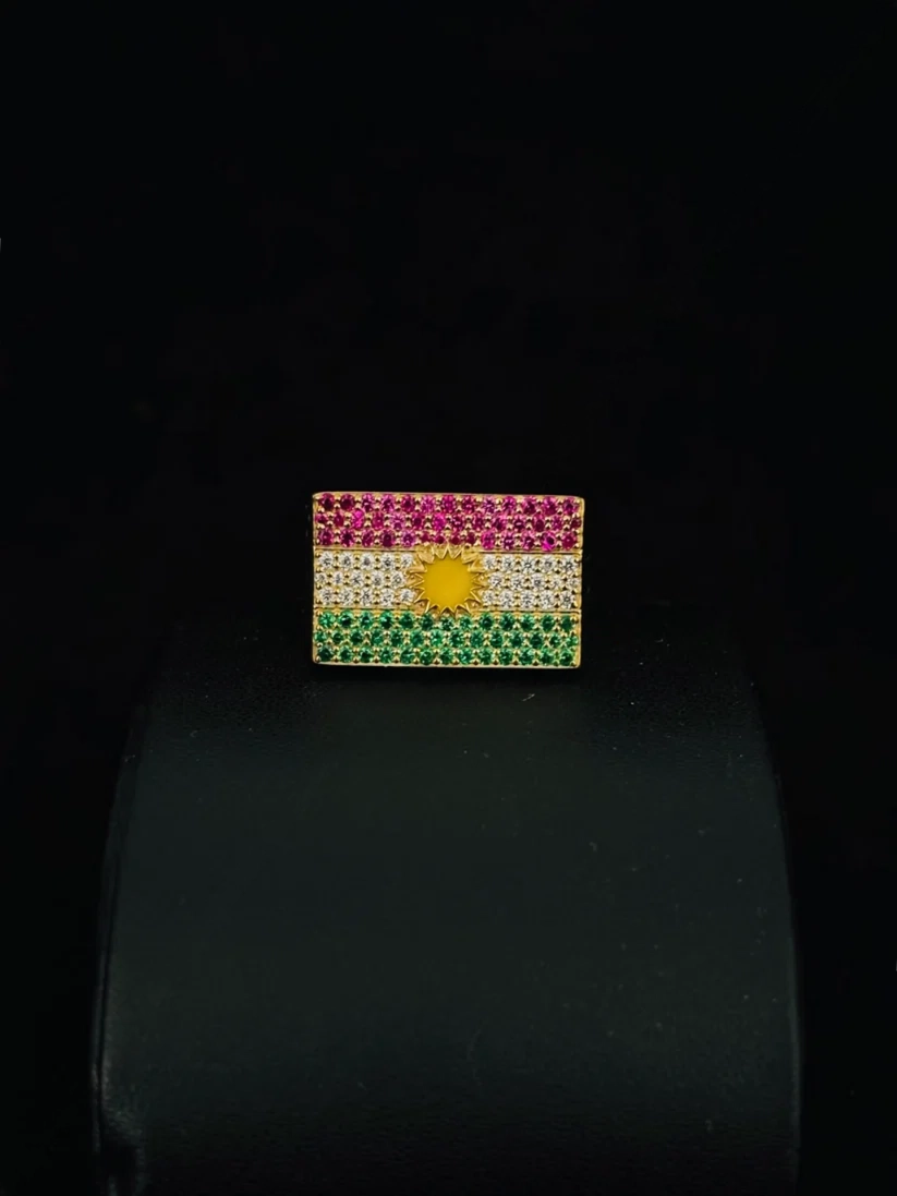 Kurdistan flag ring featuring red white and green gemstones with a yellow sun center