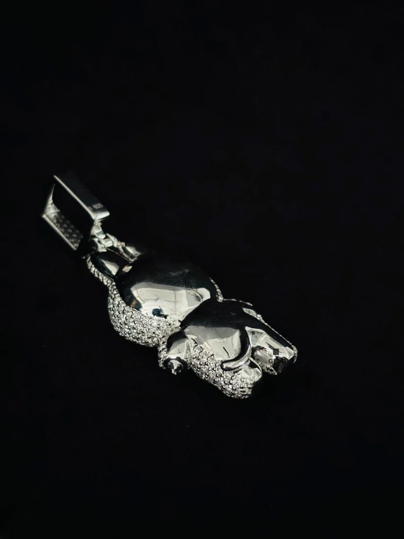 side view iced-out silver panther pendant necklace charm encrusted with diamonds