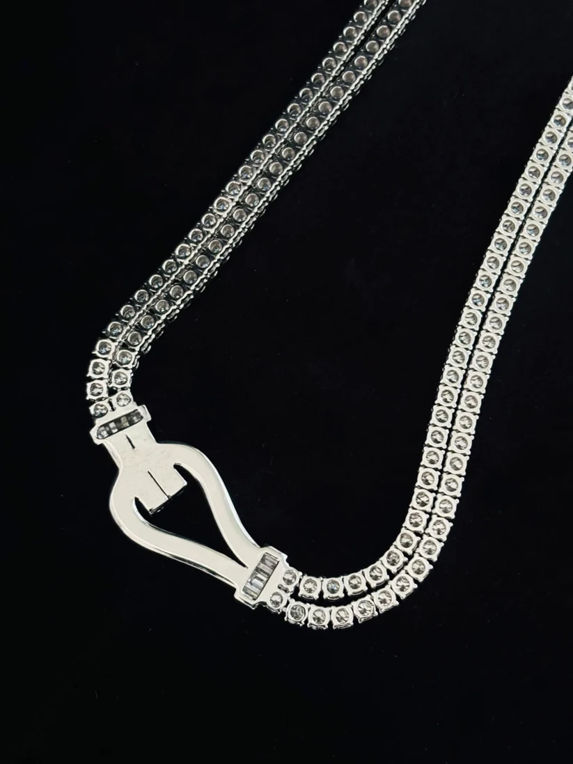 Luxury double strand diamond necklace in white gold with statement buckle closure.