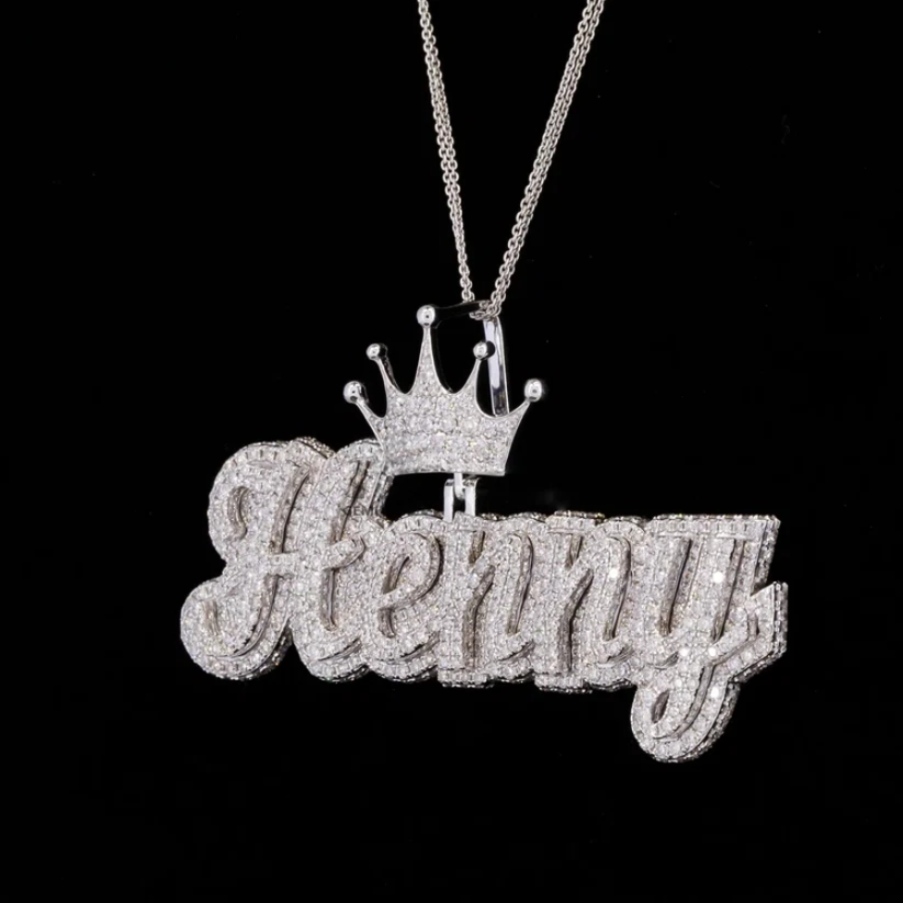 front view Iced out custom nameplate pendant reading 'Henny' in cursive font with a diamond crown accent on a silver chain
