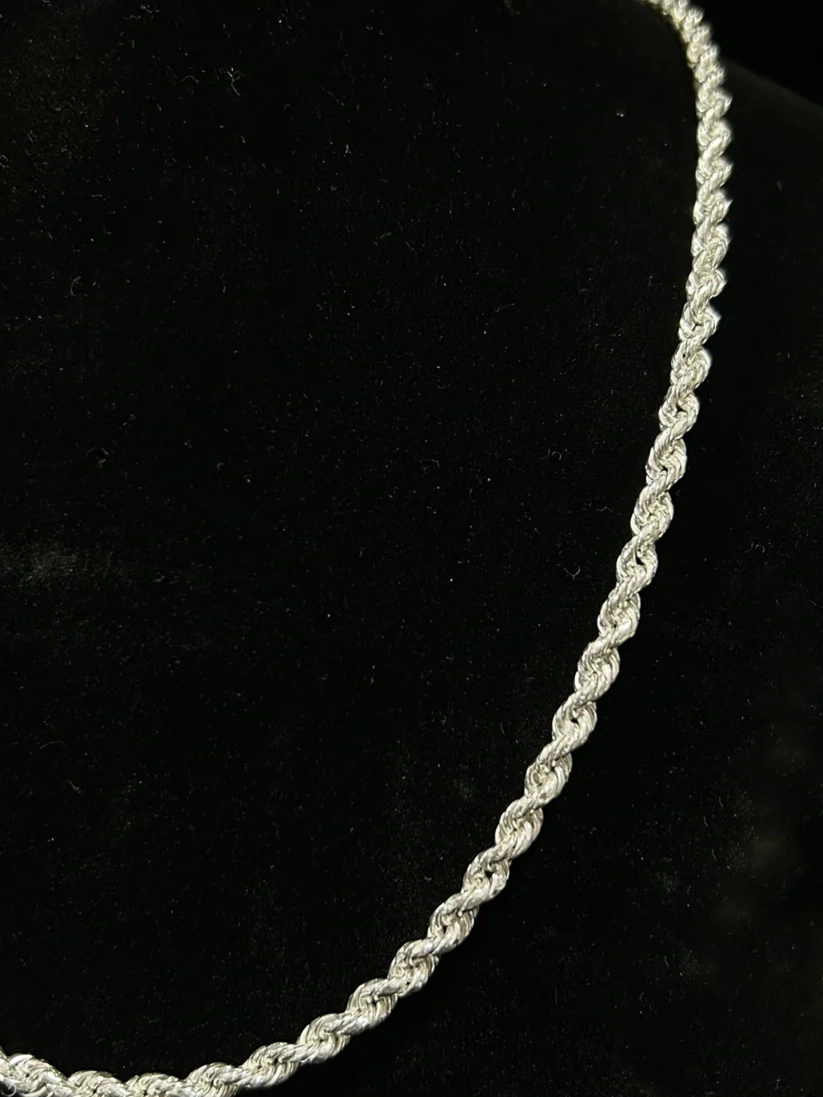 Men's silver rope chain necklace close-up view