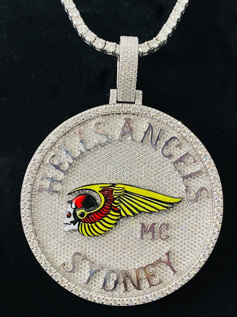 front view Silver diamond-encrusted Hells Angels MC Sydney medallion pendant necklace featuring the iconic winged death head logo in yellow and red enamel.