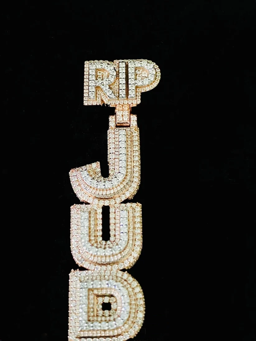 Custom diamond vertical name pendant necklace reading 'RIP JUDD' in hip hop iced out baguette letters