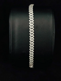 A front view Iced out diamond prong Cuban link bracelet in Silver