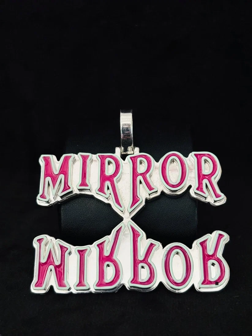 front view Sterling silver custom hip hop pendant with pink enamel "Mirror Mirror" reflective design.