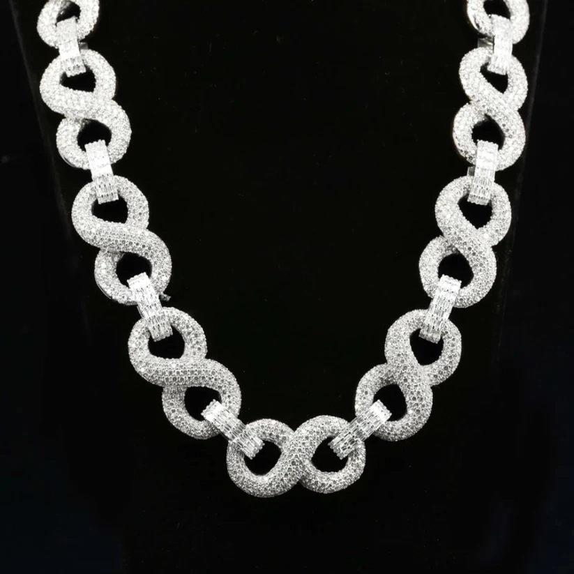 Silver iced out infinity link chain necklace with diamonds.