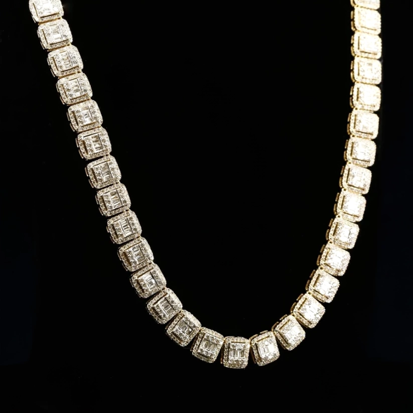 Close up of a luxury gold iced out diamond chain necklace against a dark backdrop