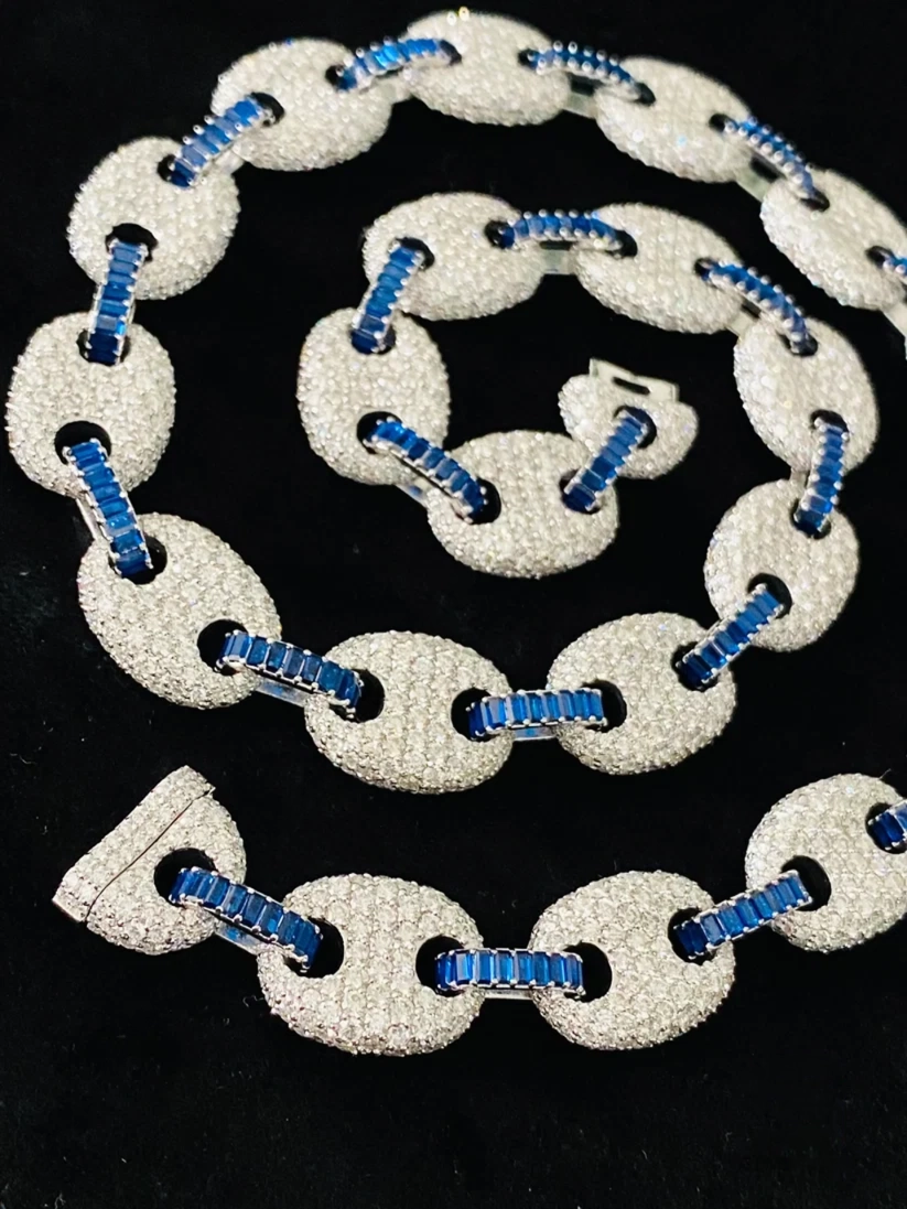 Pave diamond puffer mariner link chain accented with channel-set blue baguette gemstones