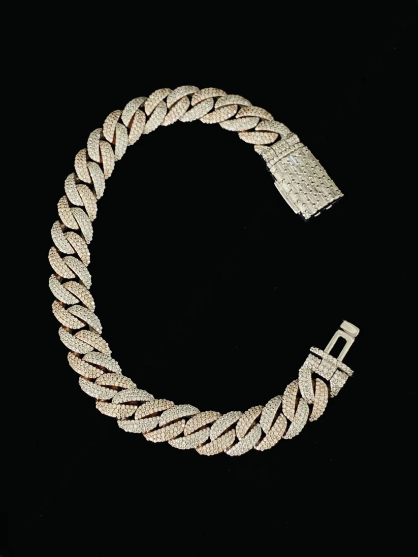 Two-tone gold and sterling silver Cuban link bracelet with clasp