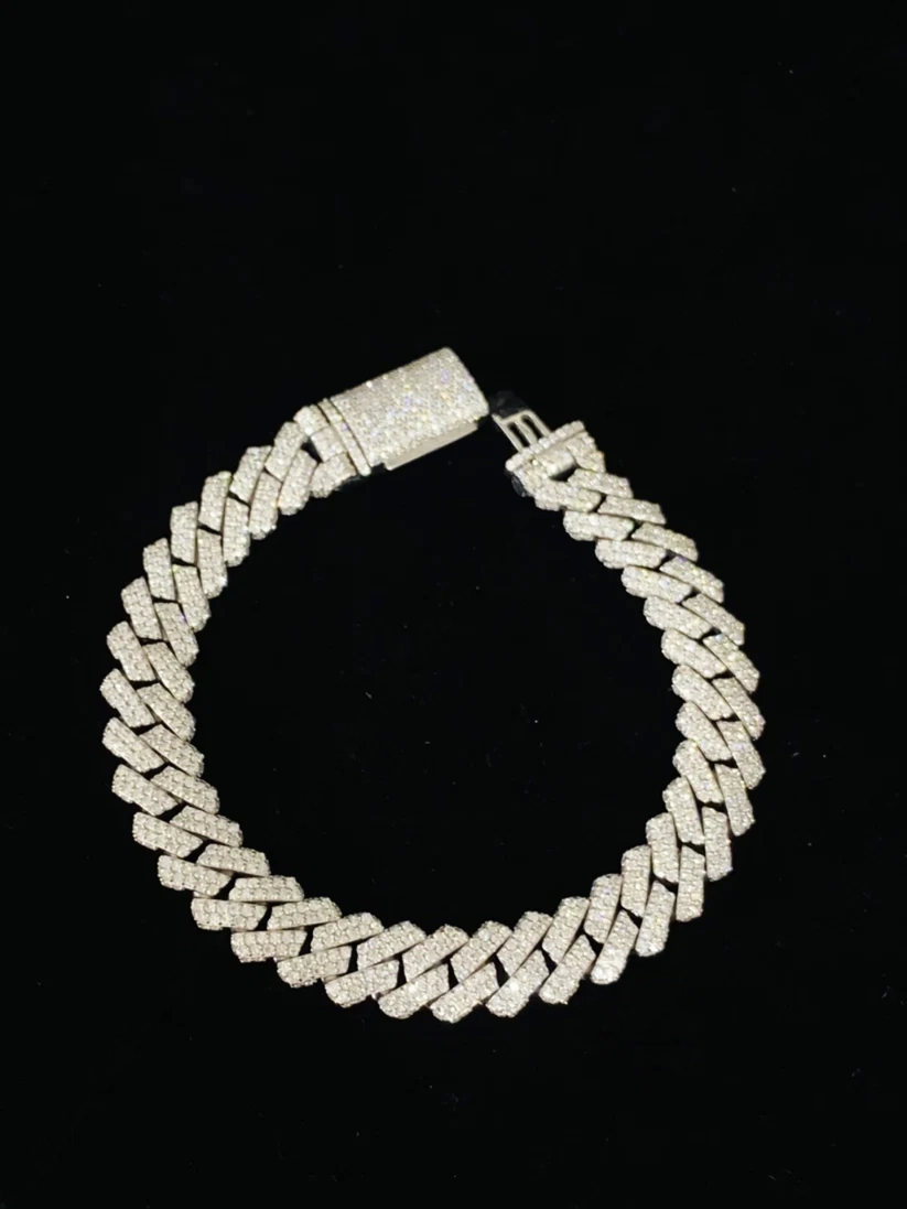A thick, chunky Cuban link chain bracelet covered in sparkling diamond