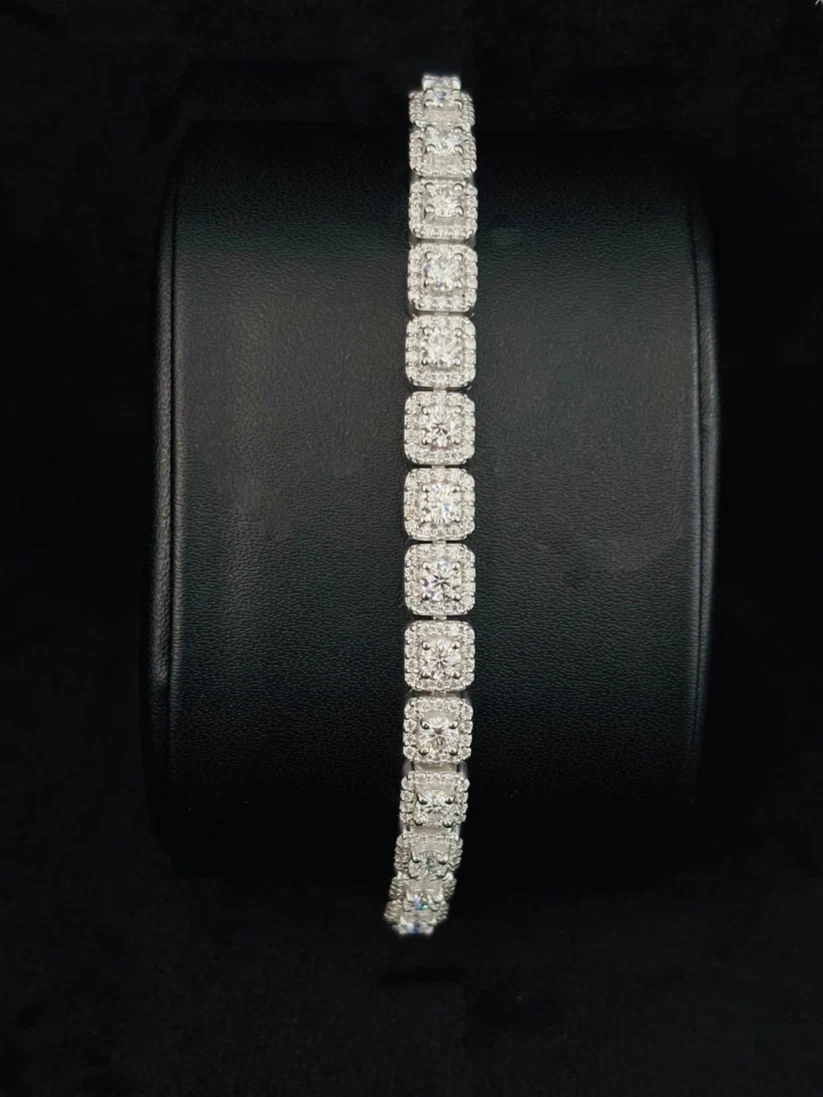 A silver tennis bracelet with square-cut, displayed vertically bracelet for her