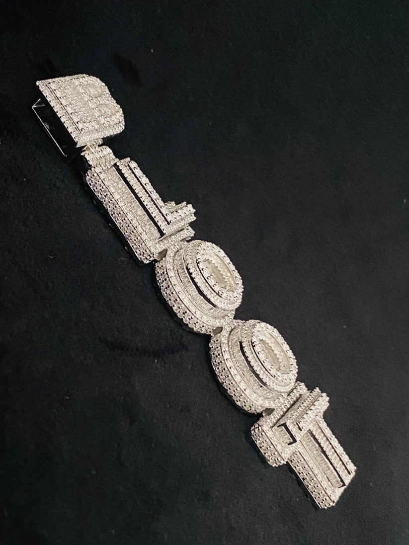 Custom iced out vertical letters name pendant in sterling silver with baguette diamonds.