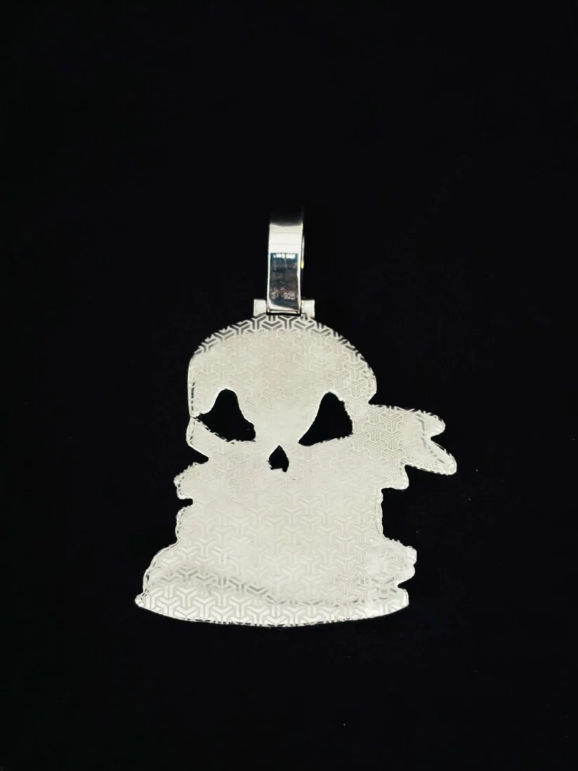 Iced out skull pendant charm with sparkling moissanite stones, back view.