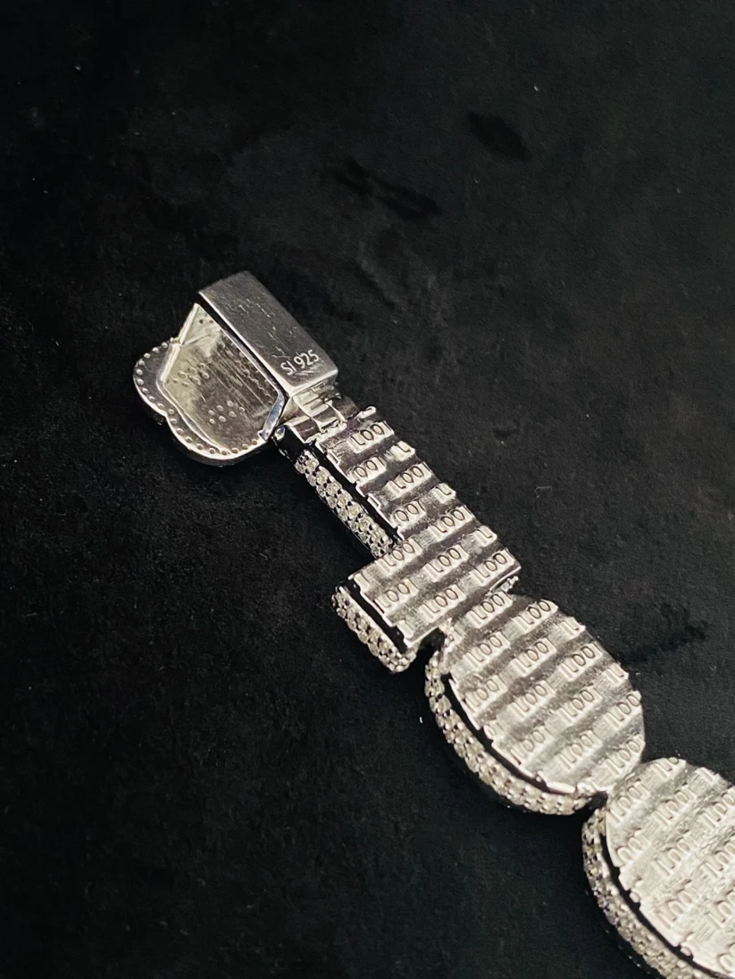 Back view of an iced out sterling silver hip hop pendant with S925 hallmark stamp