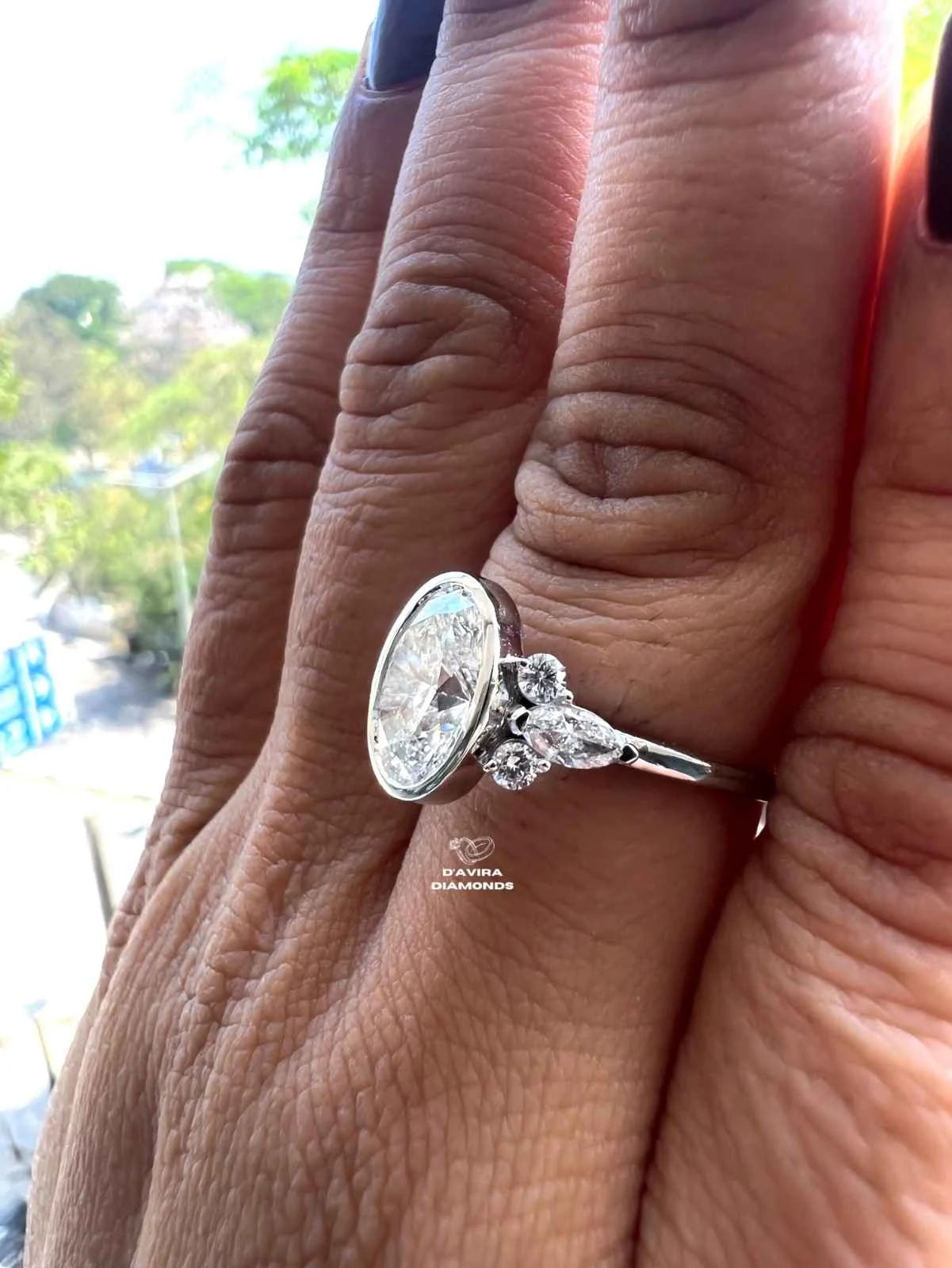 Lab grown oval engagement rings with Bezel Setting Featuring oval Side Stones