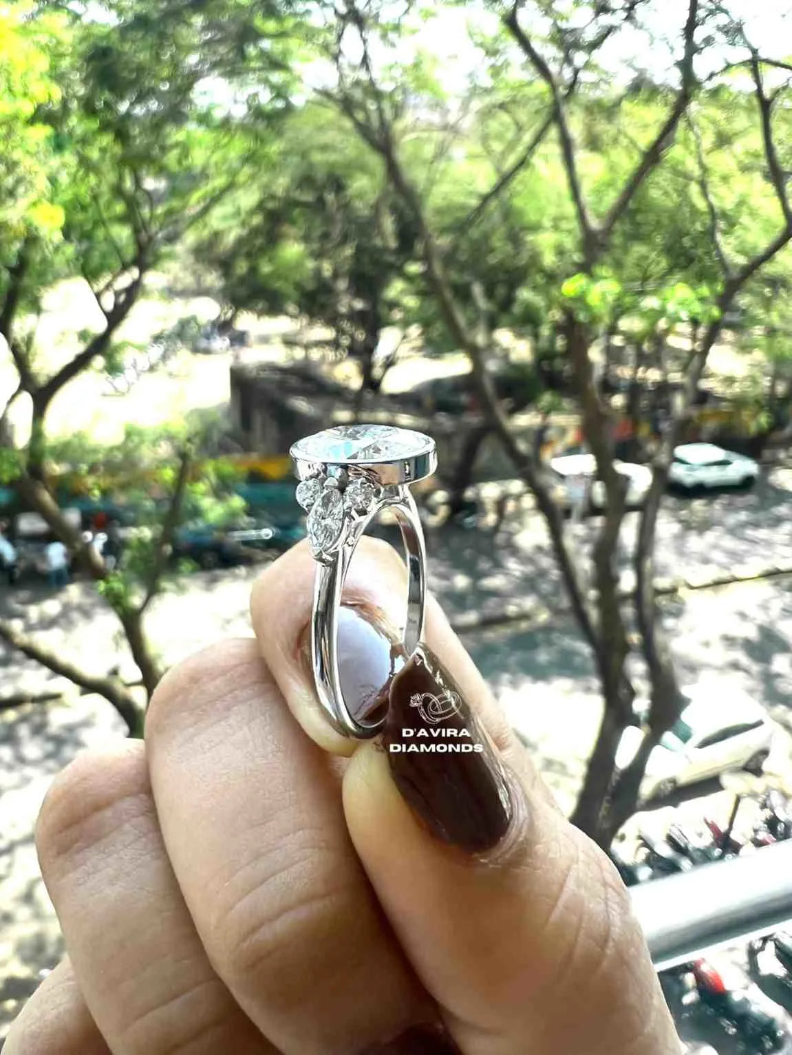 Lab grown oval engagement rings with Bezel Setting Featuring oval Side Stones