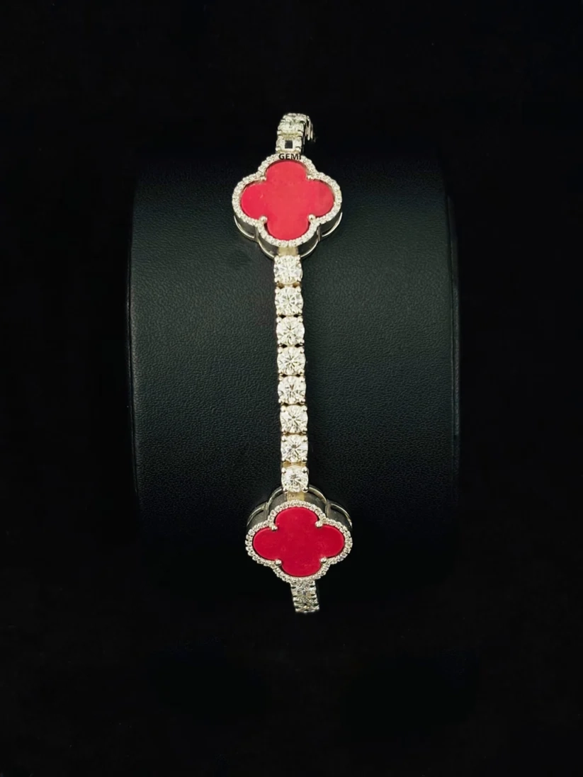 Close-up view Red carnelian clover tennis bracelet with diamond border and silver chain