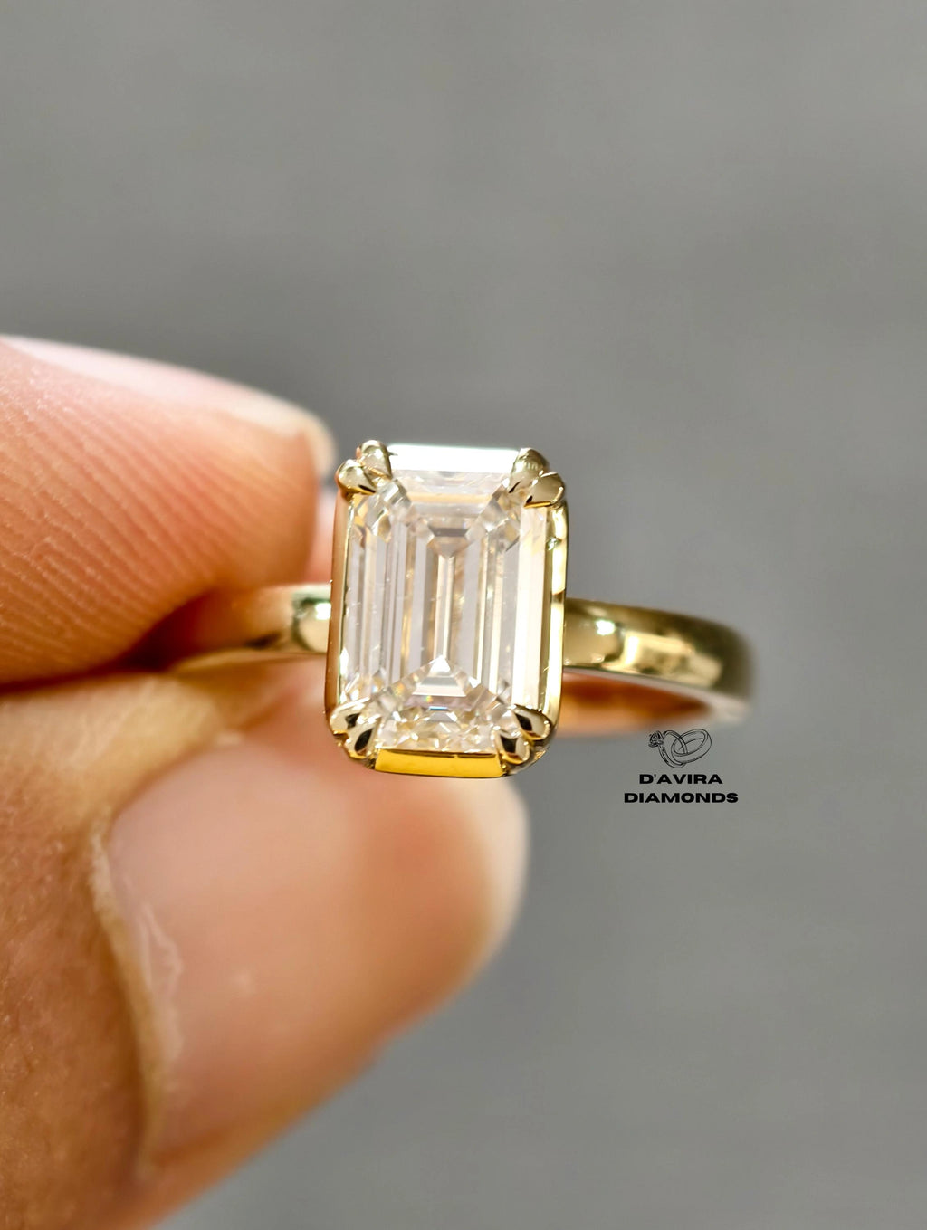 close up emerald cut lab diamond anniversary ring