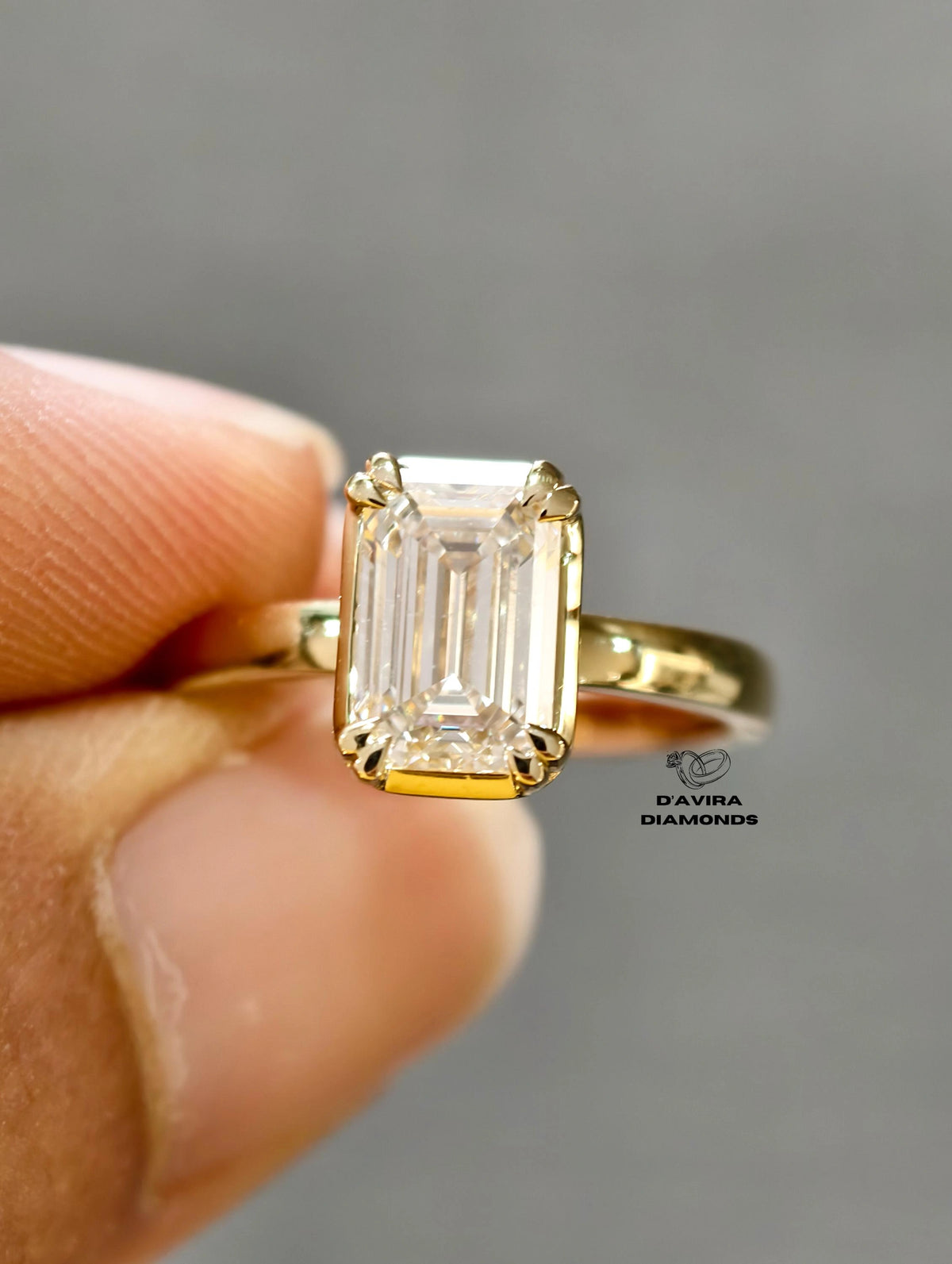 close up emerald cut lab diamond anniversary ring